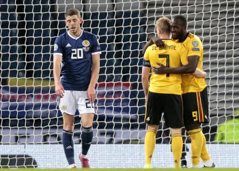 Scotland's Ryan Christie (left) after Belgium's Romelu Lukaku celebrates scoring his side's first goal of the game with Kevin De Bruyne during the UEFA Euro 2020 qualifying group I match at Hampden Park, Glasgow.