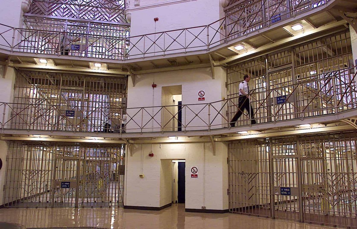 File photo dated 30/03/00 of a prison officer in the Rotunda area of HMP Manchester. The prison has been assessed by inspectors as having made slow and weak progress in many key areas where improvement was urged after a full inspection in 2018.