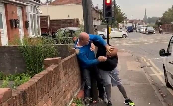 Middle-aged motorists launch into brawl beside traffic lights in fit of road-rage