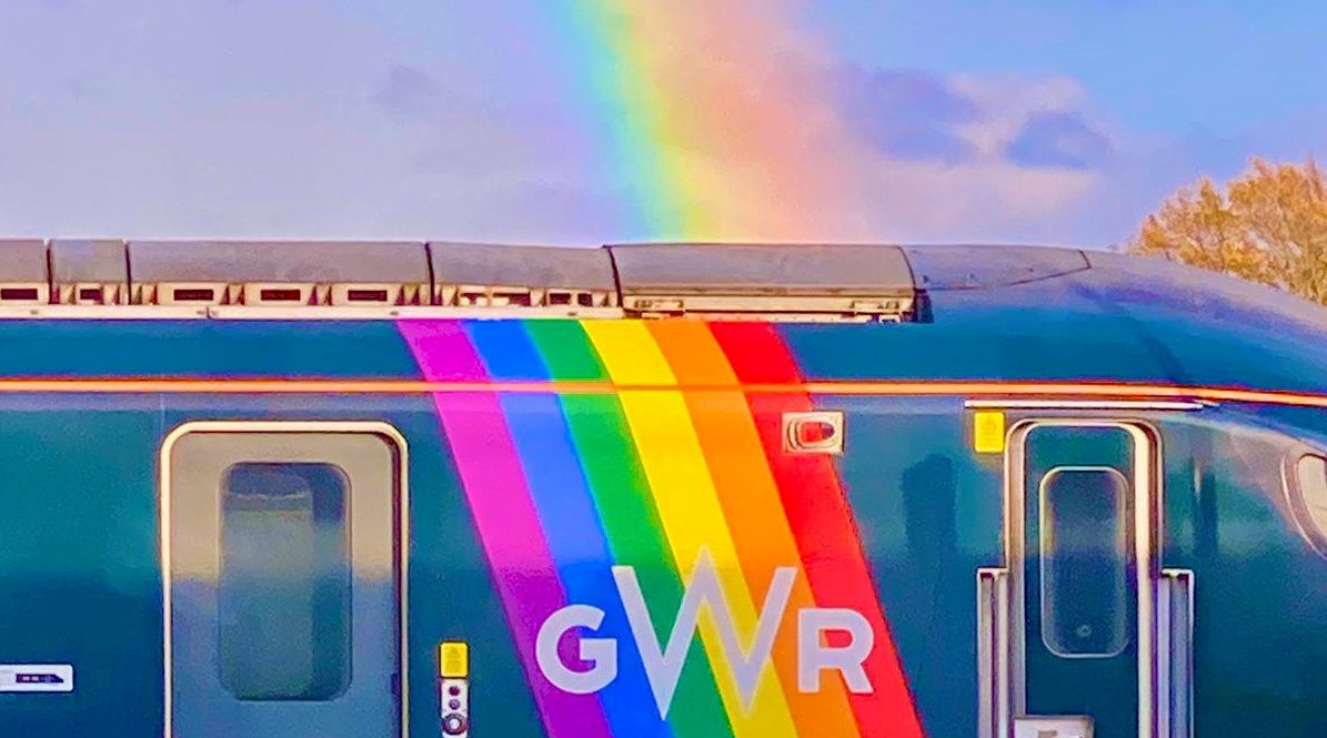 Amazing photo of a sunset rainbow – perfectly in line with a GWR Pride train