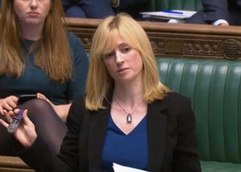 Labour MP for Canterbury, Rosie Duffield, holds up a medal from one of her constituents in the House of Commons in London. Credit;PA