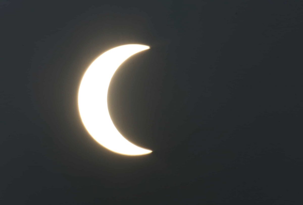 A partial solar eclipse is seen from Karachi, Pakistan, Thursday, Dec. 26, 2019. The last solar eclipse of 2019 was witnessed in Pakistan along with several other countries. (AP Photo/Fareed Khan)