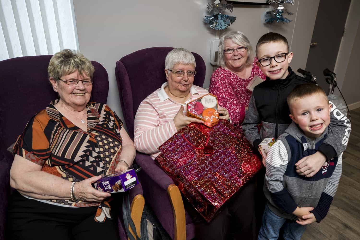Young boy saves up his pocket money to buy Christmas gifts for pensioners