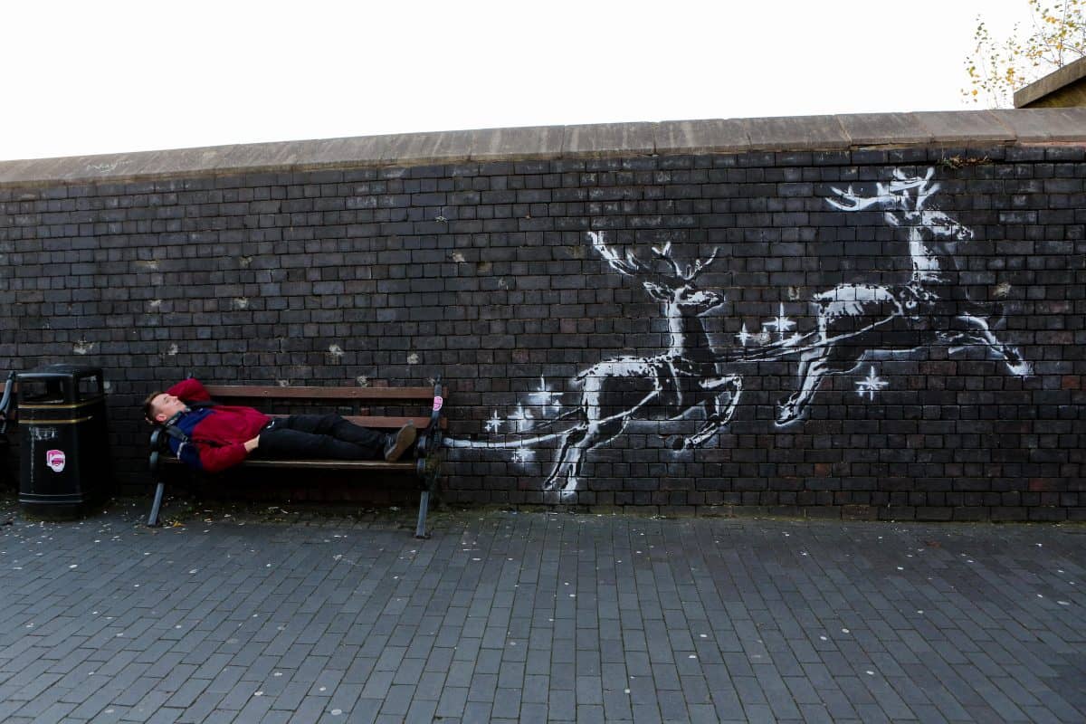 Mural of homeless man in reindeer sleigh is unveiled by Banksy to highlight homelessness