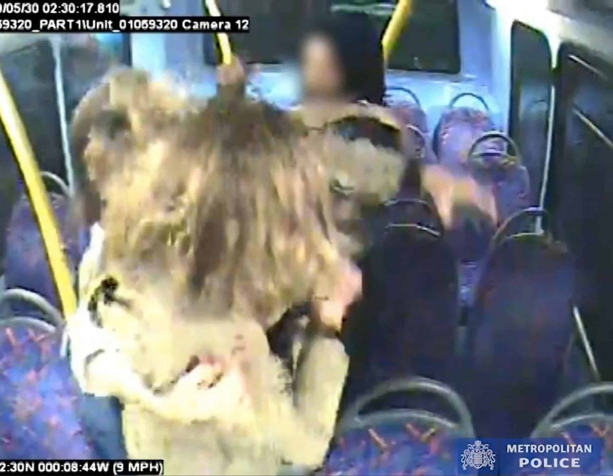 Handout CCTV grab issued by the Metropolitan Police of Melania Geymonat and her girlfriend Christine Hannigan being surrounded by a group on teenagers during an incident on a London bus in the early hours of May 30. A teenager who admitted targeting a same-sex couple on a night bus after they refused to kiss will be sentenced later on Thursday.