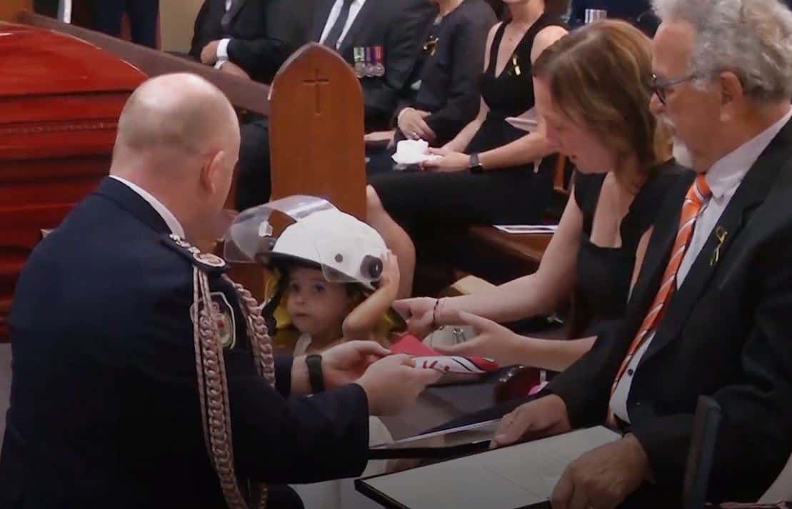 In Video: Australian firefighter’s daughter wears his helmet at his funeral