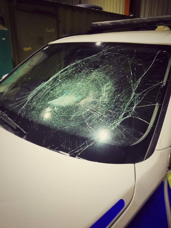 Police car with windscreen smashed – after someone threw a swede at it