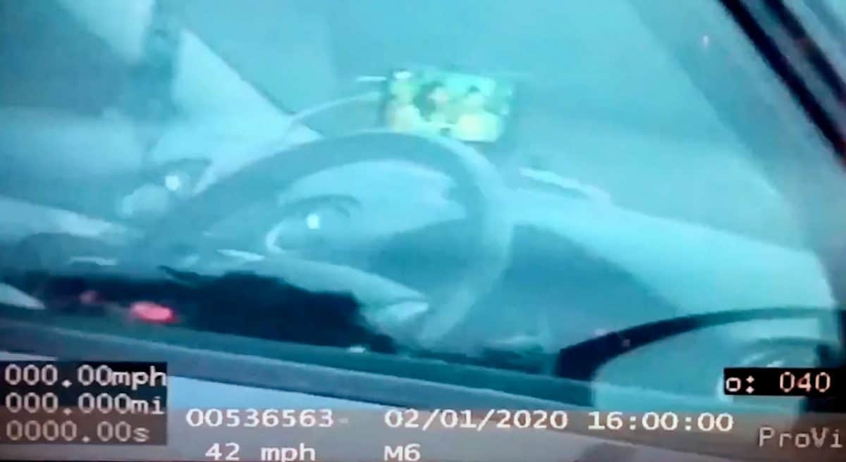 Motorist caught by police after being filmed watching TV on his phone