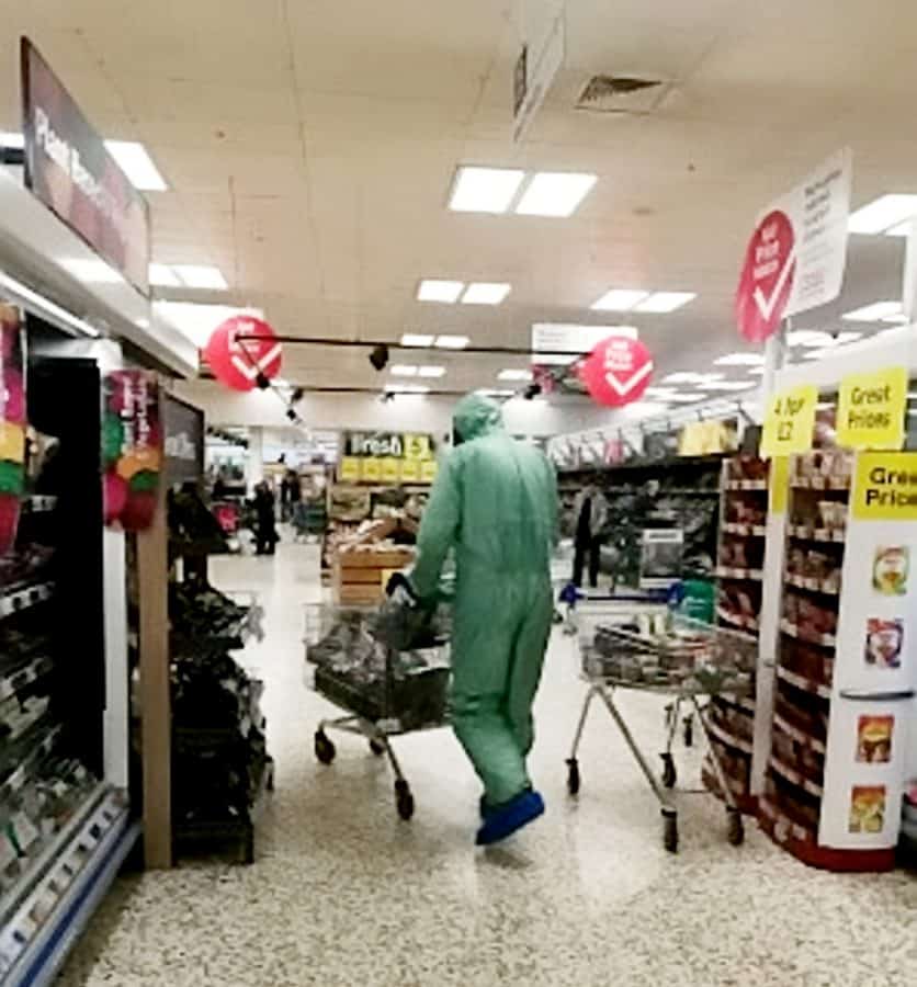 Tesco shopper bulk-buying meat – dressed in full hazmat suit and gas mask
