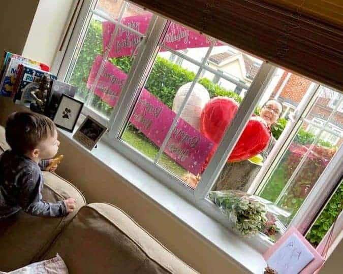 Mum delivered surprise birthday treats to daughter in isolation…through window