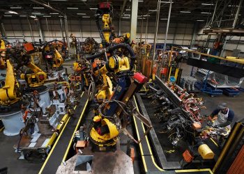 Workers on the production line at Nissan's factory in Sunderland after they were told that the car manufacturer is to end the night shift at its UK plant.