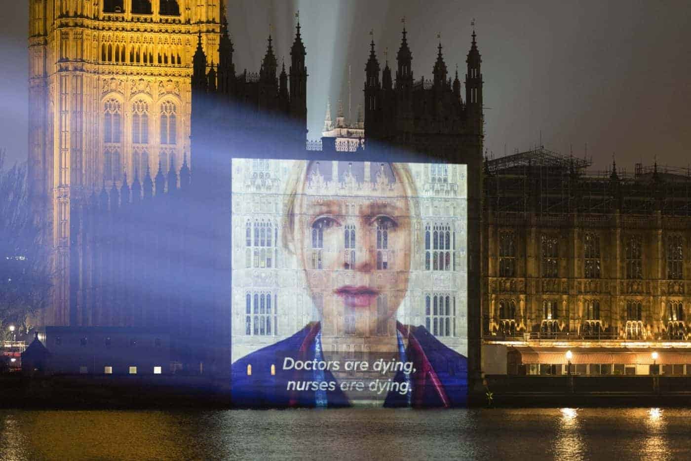 NHS staff plea for PPE in video projected onto Palace of Westminster