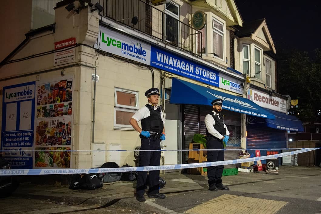 Police attend the scene in Aldborough Road North, Ilford, east London where a baby girl and a boy aged three have been stabbed to death while a 40-year-old man was found injured and was taken to hospital.