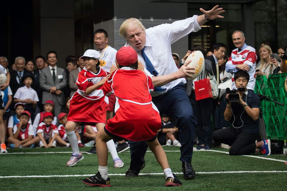 Mayor of London Boris Johnson joins a Street Rugby tournament in a Tokyo street with school children and adults from Nihonbashi, Yaesu & Kyobashi Community Associations, to mark Japan hosting 2019 Rugby World Cup where Mr Johnson is on the final day of his four day trade visit to Japan.Credit;PA