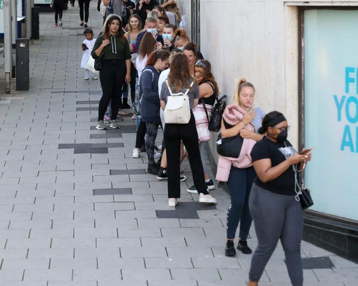 Shoppers queue outside Primark in Bristol on the first day that non essential shops are allowed to opening following coronavirus restrictions, June 15 2020. Credit;SWNS