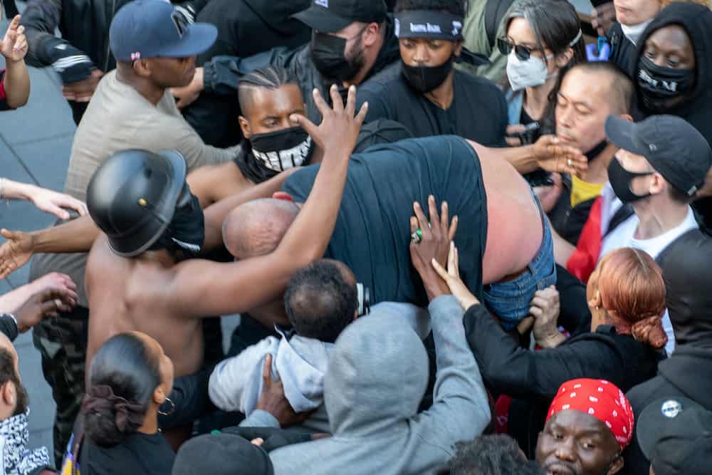 Photos show lead up to Patrick Hutchinson rescuing white counter protestor