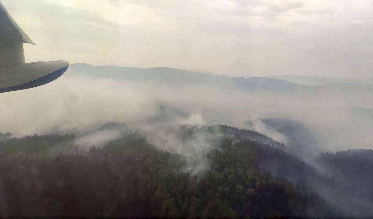 This image taken from video provided by Russian Emergency Ministry, shows a view of a forest fire from a Russian Emergency Ministry multipurpose amphibious aircraft in the Trans-Baikal National Park in Buryatia, southern Siberia, Russia, Thursday, July 9, 2020. About 910 hectares of forest were alight over this area of the Russia's region, according to the ministry of emergency situations. (Russian Emergency Ministry Press Service via AP)