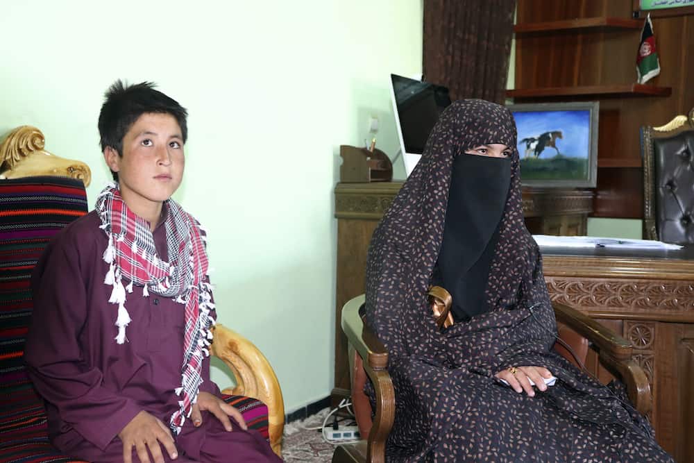 Qamar Gul, 16, right, and her brother Habibullah, 12, left, poses for photograph in the governor house of Ghor province western of Afghanistan, Tuesday, July 21, 2020. A 16-year old Afghan girl who killed Taliban who attacked and killed her parents in western Ghor province has become a local hero. (AP Photo)