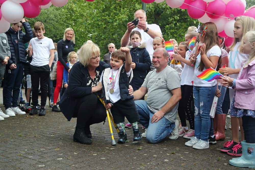 Boy, five, with prosthetic legs raises £1m for hospital in walking challenge