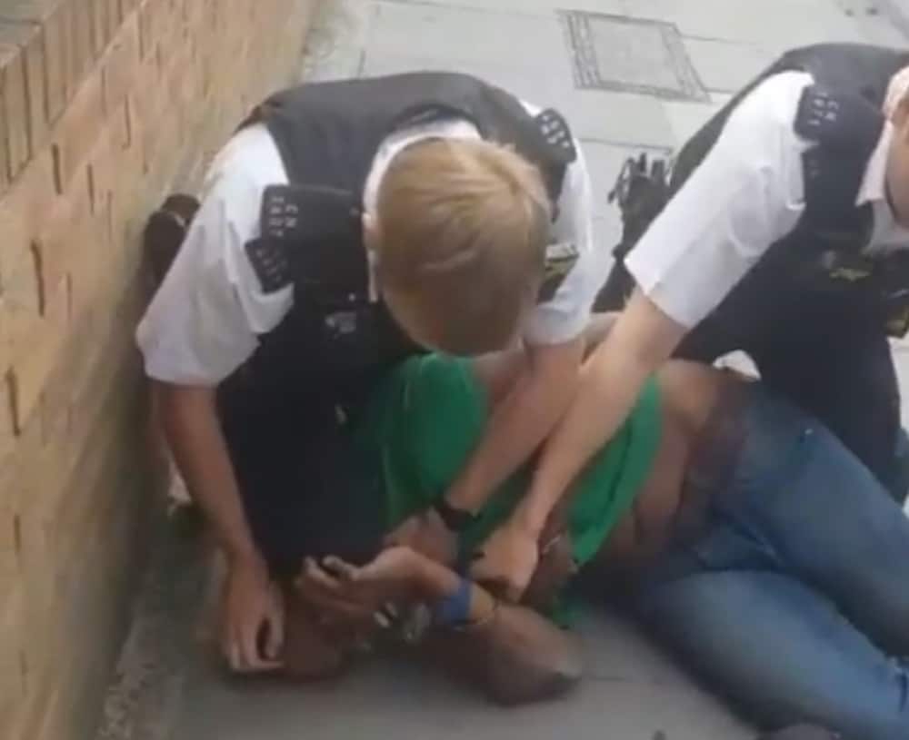 Undated handout videograb of a Metropolitan Police officer who has been suspended and another placed on restricted duties after the video appeared to show one of them kneeling on man's neck.