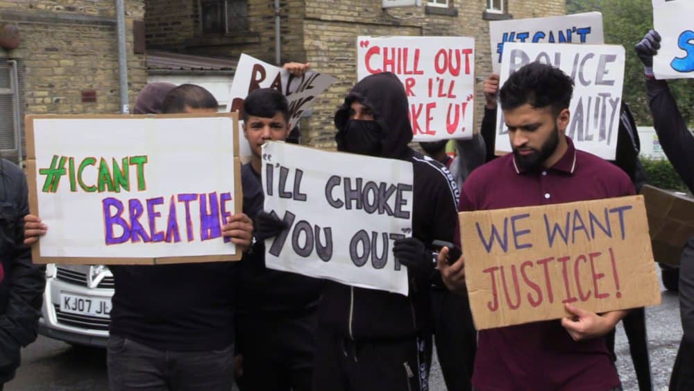 People with placards, gathered for a demonstration outside Halifax police station on Wednesday afternoon. A West Yorkshire officer has been suspended after a video was widely shared of Hassan Ahmed, 27, being arrested in Halifax on Sunday. Safyah is Hassan Ahmed's sister.Credit;PA