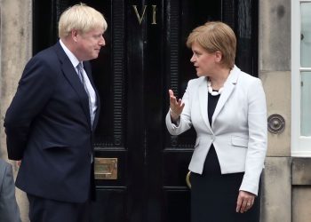 Scotland's First Minister Nicola Sturgeon welcomes Prime Minister Boris Johnson outside Bute House in Edinburgh ahead of their meeting.