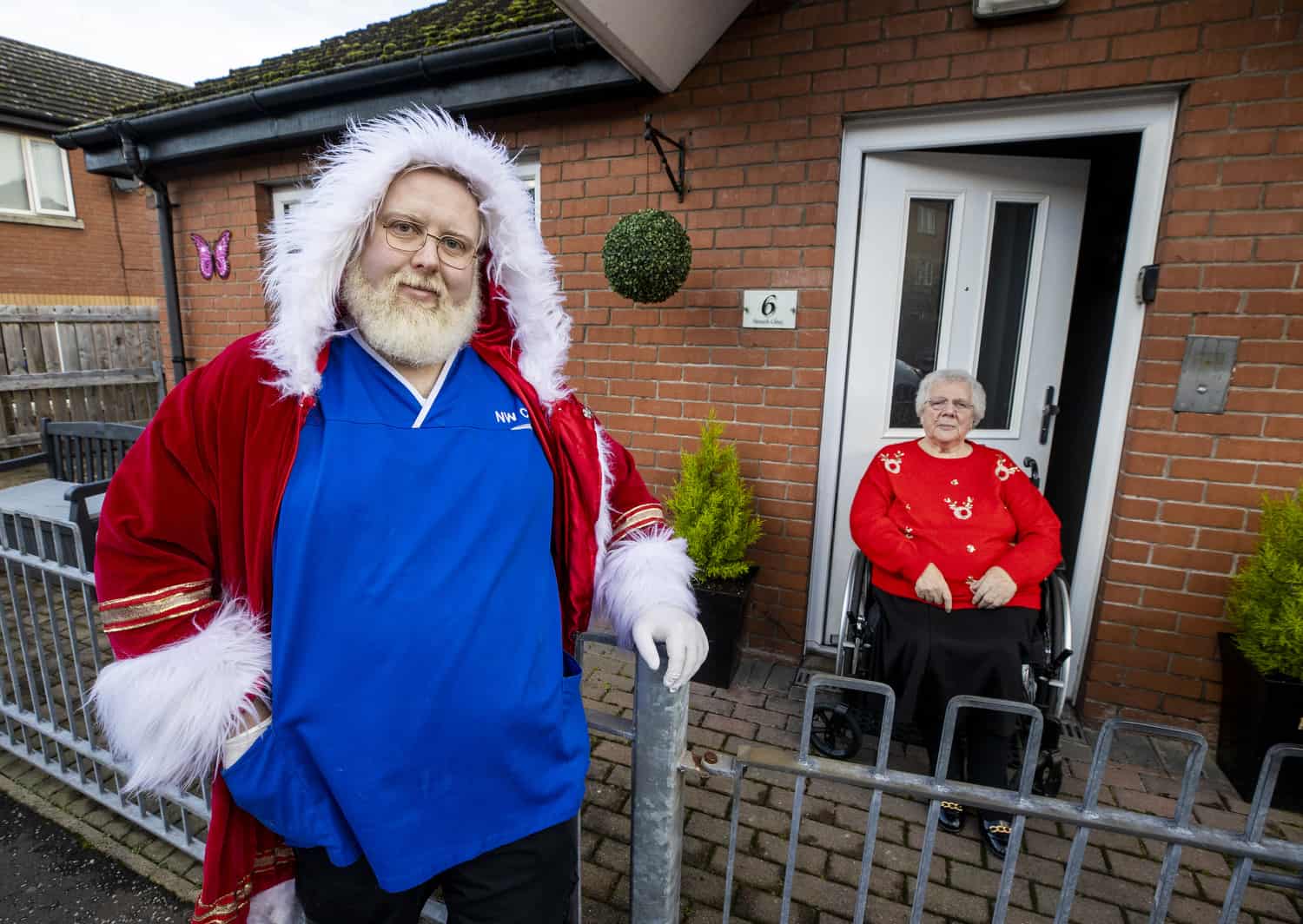 Santa lookalike care worker delivers festive cheer on home visits