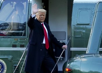 President Donald Trump waves as he boards Marine One on the South Lawn of the White House, Wednesday, Jan. 20, 2021, in Washington. Trump is en route to his Mar-a-Lago Florida Resort. (AP Photo/Alex Brandon)