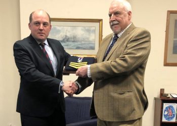 Handout photo issued by Liberty of Falklands veteran Joe Ousalice (right), 68, being given his medal for long service and good conduct by Defence Secretary Ben Wallace.
