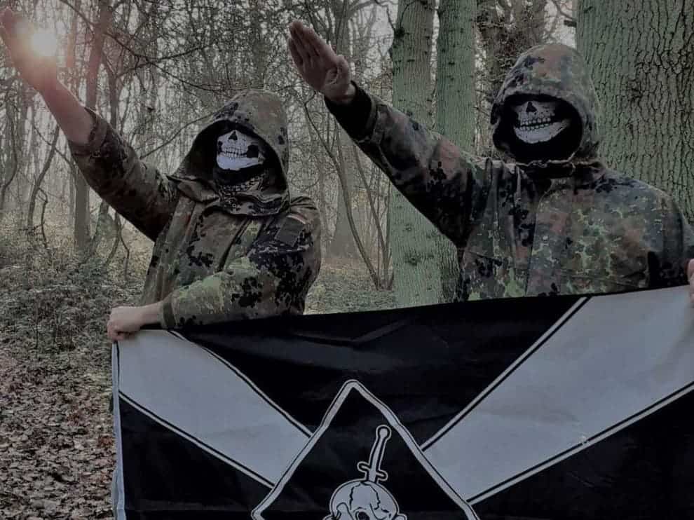 Two members of Feuerkrieg Division, not including the defendant, posing in a photo posted in an online chat

(Eugene Antifa)