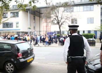 A police officer outside Pimlico Academy School, west London. Credit;PA