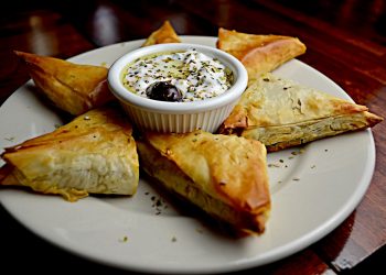 Filo pastry parcels with feta, couscous, and dates