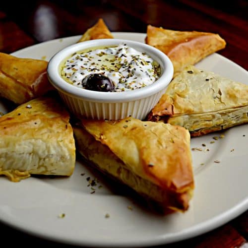 Filo pastry parcels with feta, couscous, and dates