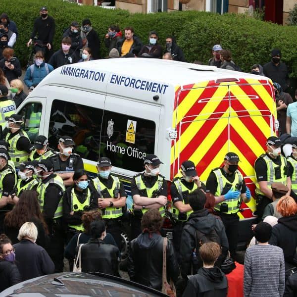 Protestors surround van to stop Home Office immigration raids