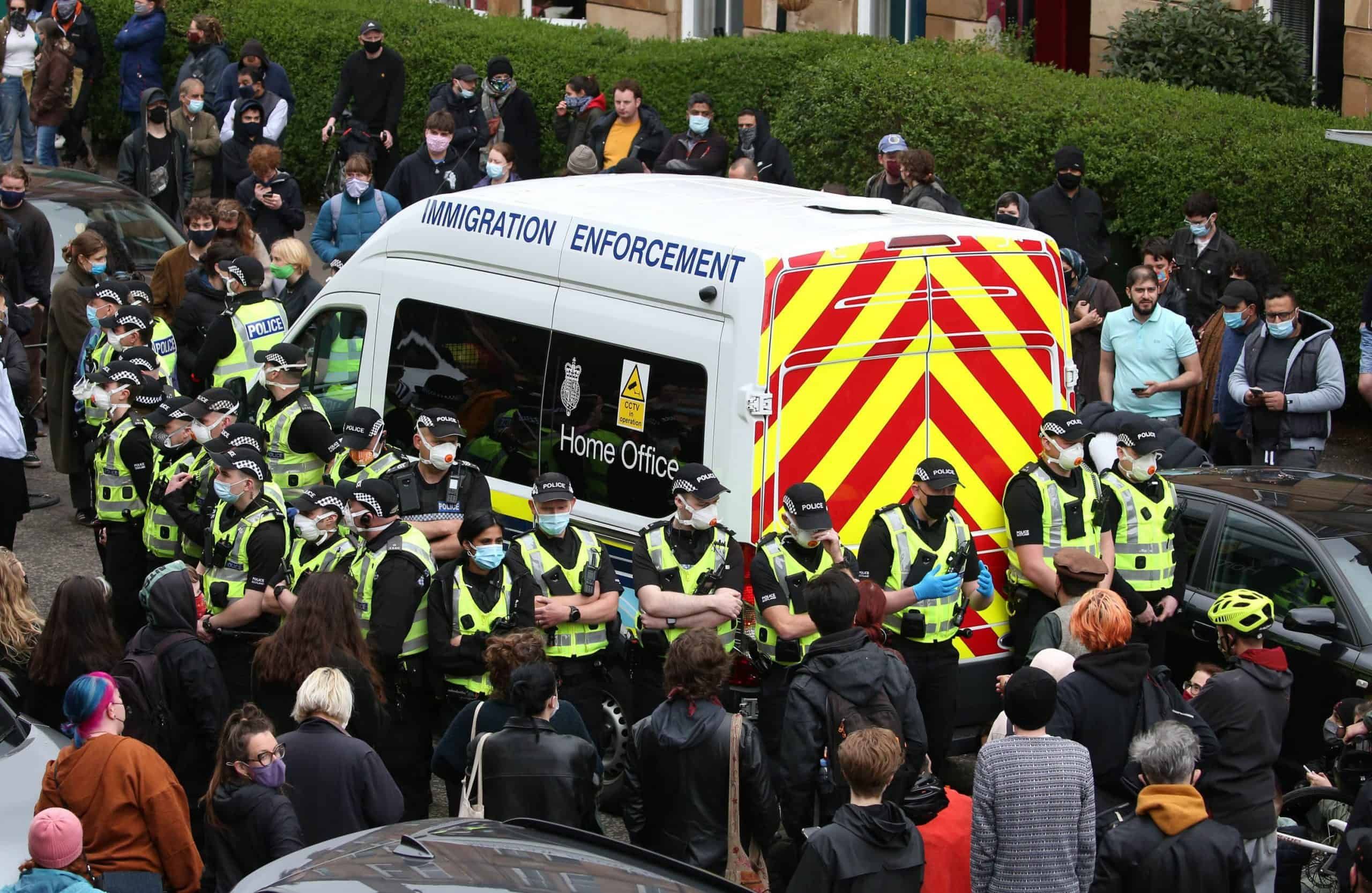 Protestors surround van to stop Home Office immigration raids