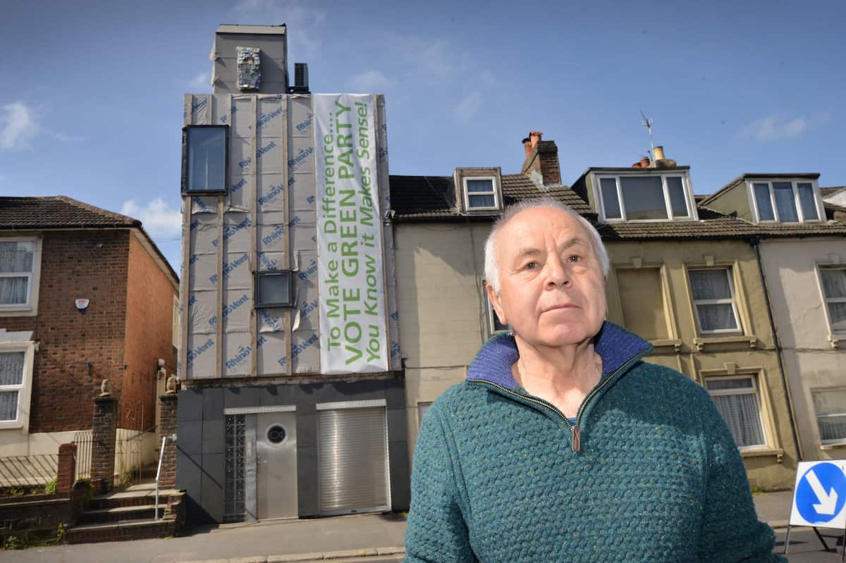 Ken Davis and his Zero carbon house in Bohemia Road, Hastings. See SWNS story SWNNeco. A green homeowner who is building the first zero carbon house in the area has been ordered to remove a storey of the renovation by the council.  Ken Davis is doing up a house in St Leonards, East Sussex, to make it the borough’s first zero carbon home. But the project has been delayed after the local council asked him to get rid one storey of the building after an application to extend and alter the property was refused.