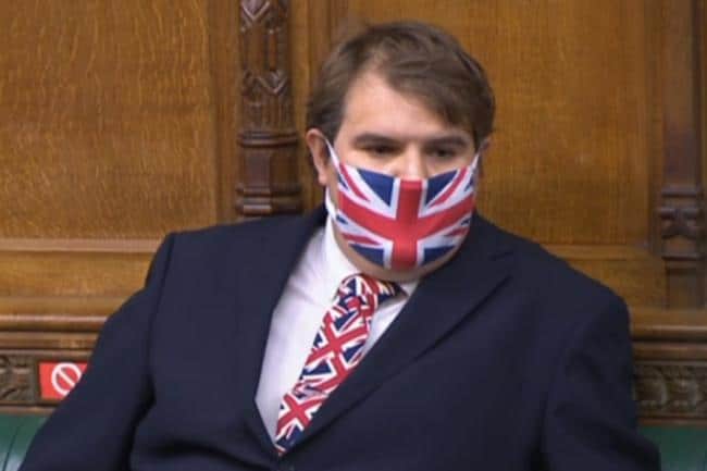 Tory MP dons Union flag tie and mask – then rants about lack of flags