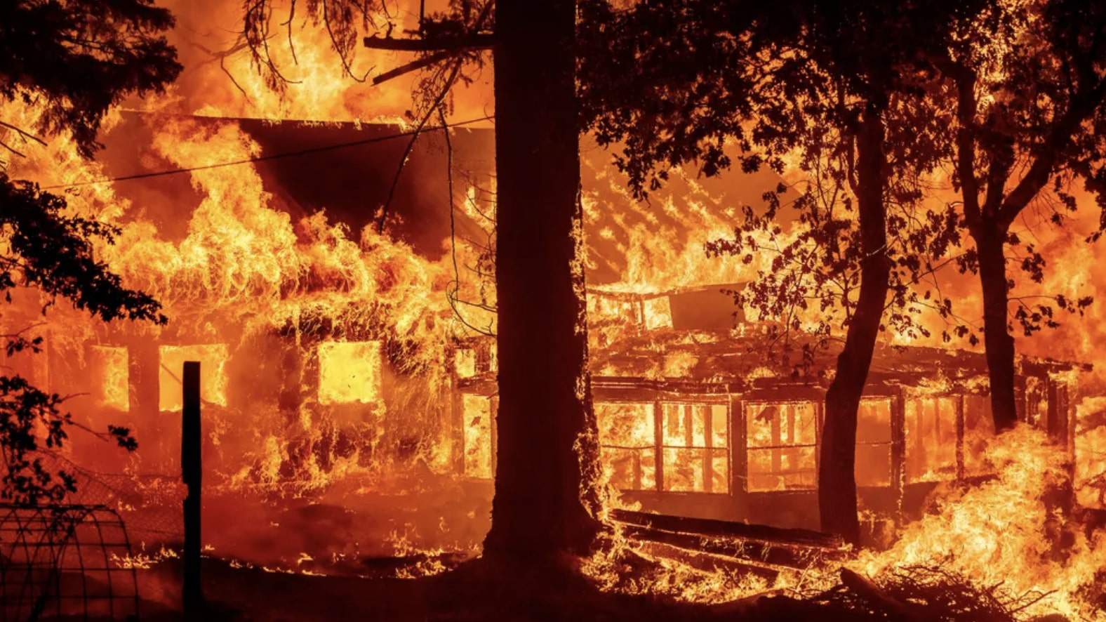 California’s largest fire torches homes as blazes lash western US