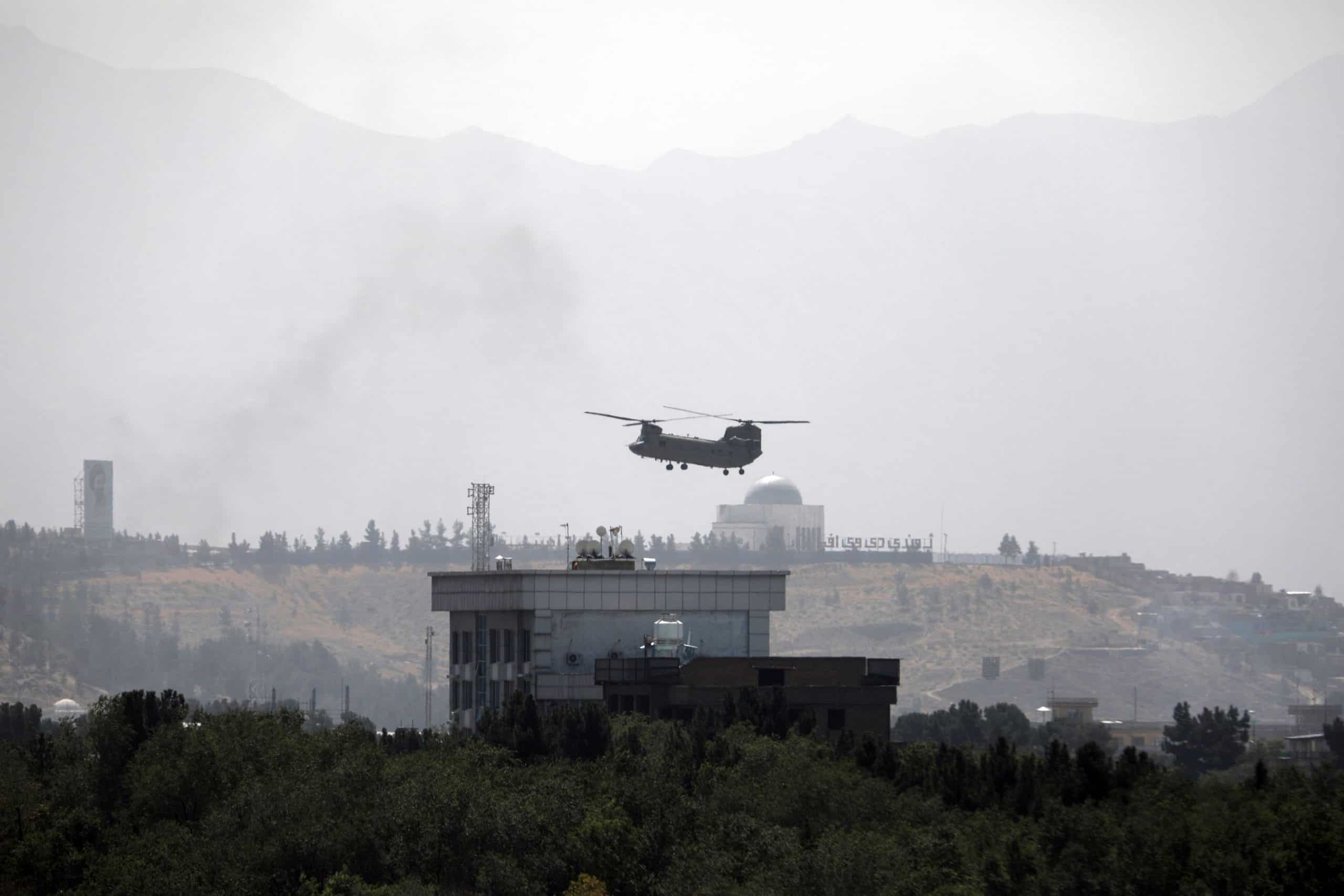 Desperate Afghans cling to US plane as it flees Taliban-controlled Kabul