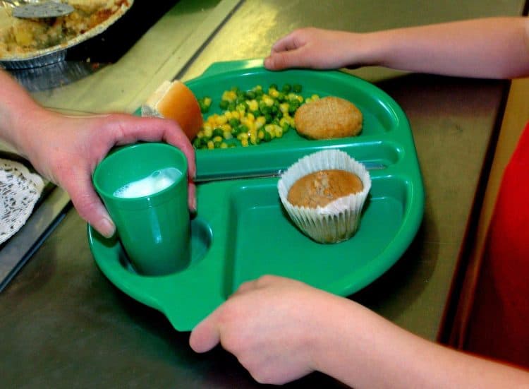 File photo dated 28/08/09 of a school meal being served. Around three in 10 school-aged children have registered for free school meals this autumn, research for food poverty campaigners suggests.