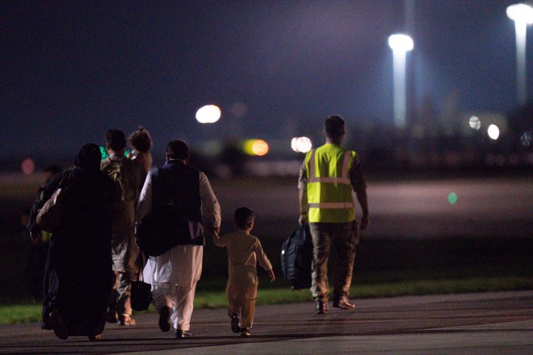 British nationals and Afghan evacuees depart a flight from Afghanistan at RAF Brize Norton. Picture date: Thursday August 26, 2021.
