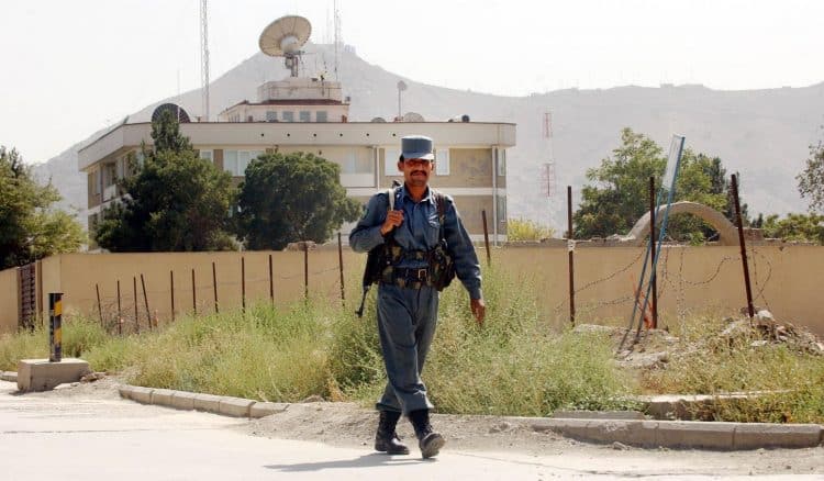 A guard walks in front of the British Embassy in Kabul, Afghanistan.