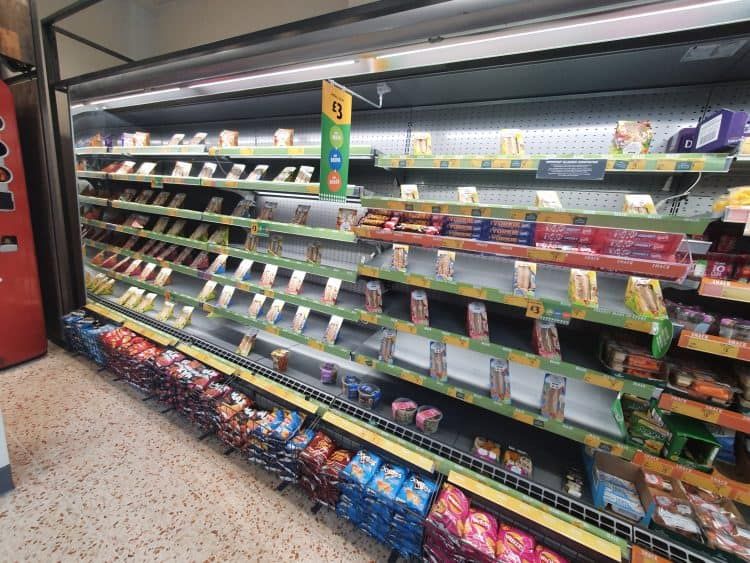 In Pics Supermarket stackers valiantly try to hide lack of stock