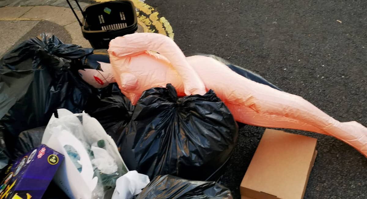 Britain’s bin round chaos laid bare…as sex doll spotted in mountains of rubbish
