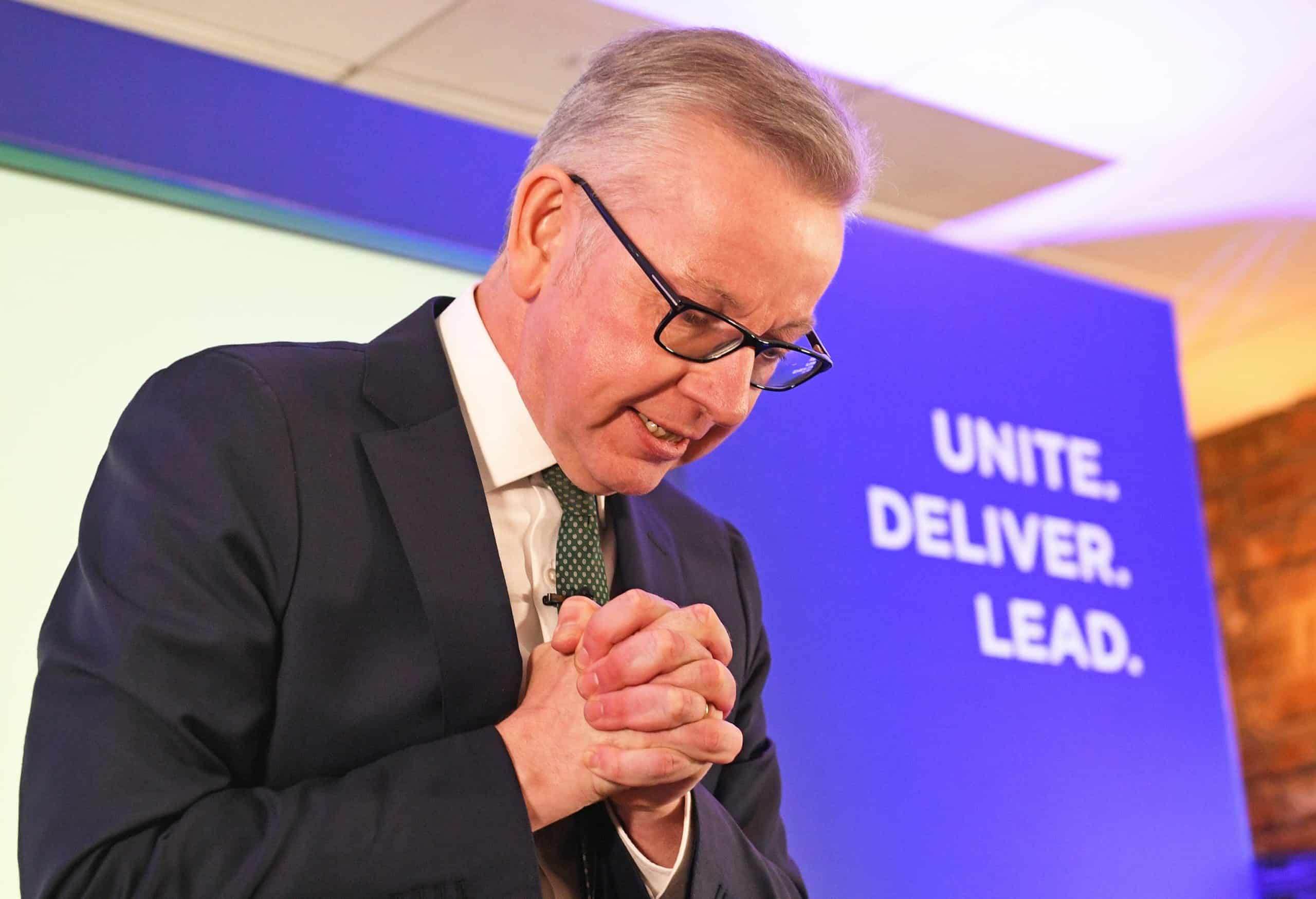 Watch: Michael Gove escorted by police after being approached by demonstrators