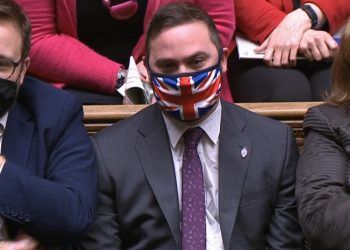 Bury South MP Christian Wakeford sitting on the opposition benches during PMQs in the House of Commons.