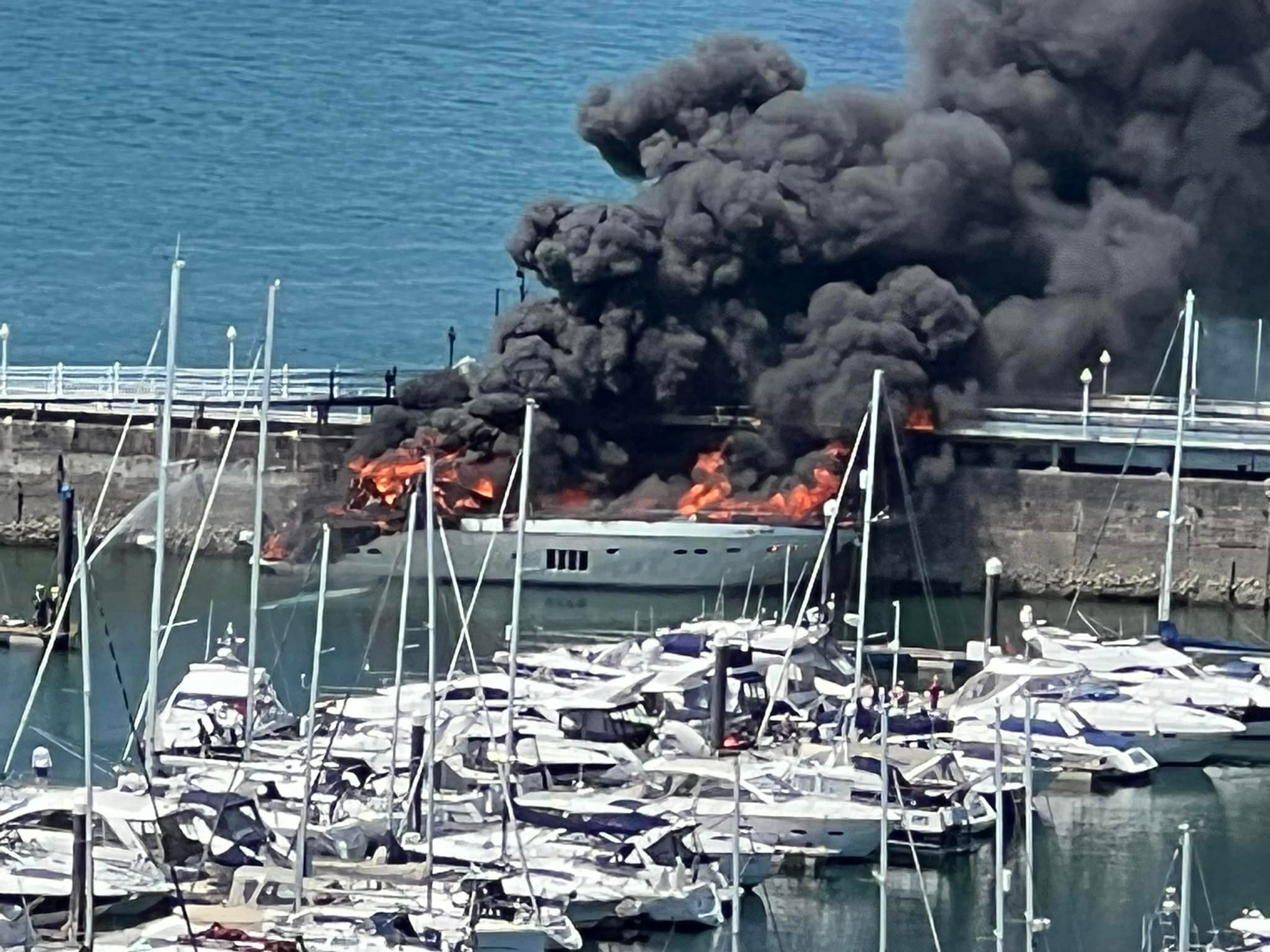 £6m Superyacht carrying 8,000 litres of fuel sinks after going up in flames at British marina