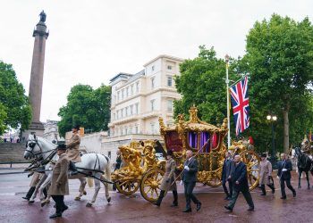 The gold state coach on The Mall during an early morning rehearsal. Credit;PA