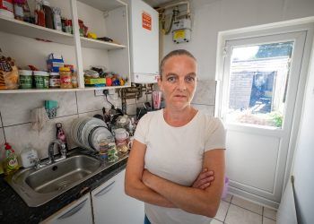 Kelly Thomson at her home in Slough.See SWNS story SWTPdonate. A starving single mum says her faith in humanity has been restored after generous Brits donated more than £1.2k in just a few hours to help feed her kids. Kelly Thomson, 43, revealed this week that she has twice been hospitalised due to malnutrition amid the cost of living crisis.She says she has been foregoing meals so her kids can eat - and has even thought about begging to make ends meet.Kelly decided to launch a GoFundMe page this morning (19/8), with a target of just £50 set.