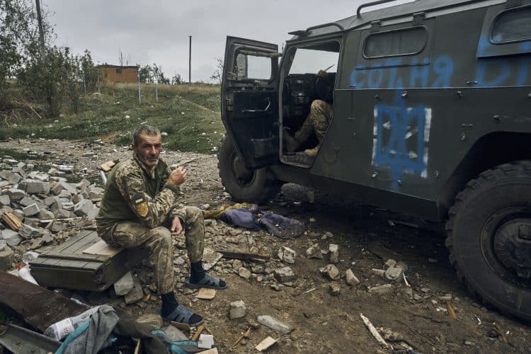 A Ukrainian soldier takes a break to rest. Credit:PA